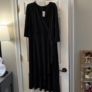 NWT beautiful black wrap, dress with side, ruffle and three-quarter sleeves.